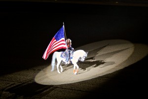 Thunder carrying the flag in the National Western Stock Show grand entry. Photo courtesy of Arabian Horse Association. 