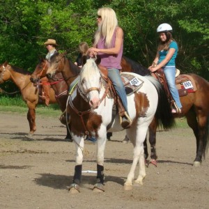 Jen Ray Urksa aboard her daughter's registered Paint Horse that was rescued from an auction. Photo courtesy of Jen Ray Urksa.