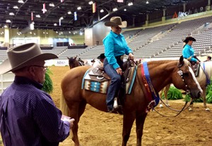 Rider Mandy McCutcheon becomes the first woman and Non Pro to be a $2 Million Rider with high scores on her dad's (Tim McQuay) stallionYellow Jersey. 