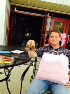 Proud papa-to-be, Cole Baker, received a tiny pair of boots for his daughter. Photo courtesy of Gordon Downey.