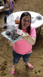 Katelyn Jerde modeling a dessert at the youth bake sale fundraiser.