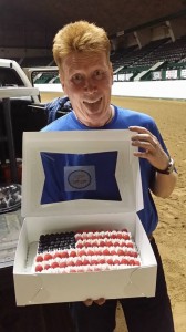 Rusty Carlson posing with the cake he won at the youth fundraiser. Rusty was the highest bidder at $160.