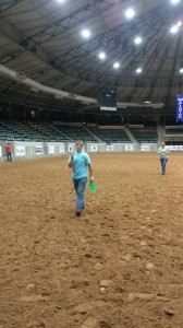 Zachary Nettles with a crisp 100.00 bill he won Tuesday night at the Frisbee Toss. He threw for his mom who won the frisbee when she placed 5th in the Novice Amateur Walk/Trot English Eq class. 