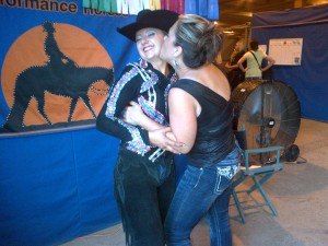 Western Pleasure 16-18 Youth World Champion - Lacey Olejar gets a congratulatory smooch from friend Kelly Sweeney. Photo courtesy of Litty Olejar. 