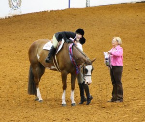 Alexa receives a big hug from her sister, Drew, following her World Championship in Walk-Trot Hunter Under Saddle.