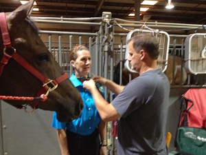 Kip Larson adjusts Linda's tie before heading in for the Showmanship preliminaries.