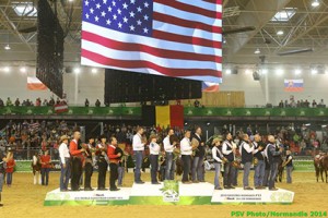 Reining team medalists salute the National Anthem of the United States. Image by PSV Photos/Alltech FEI World Equestrian Games in Normandy