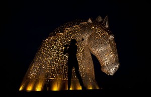 A golden opportunity for tourism. VisitScotland's Sarah Drummond helps promote tourism in Scotland as the Kelpies are light in gold to mark the start of The 2014 Ryder Cup. PICTURE BY GARETH EASTON PHOTOGRAPHY 