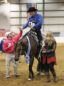 Gordon Downey give Robert Huver a high five while he and his daguther, Livvie Van Lanen a