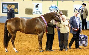 Suzanne Kiser gives "Little Dawn" a kiss for a job well done.