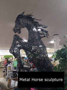 Large rearing horse sculpture. This art piece stands approximately 6’ tall. 