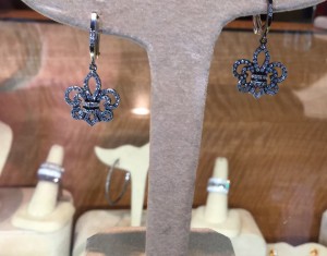 14 K white gold Fleur de Lis Diamond drop earrings. Secure lever backs retail: $1,150. Donated by Hannah's Jewelry.
