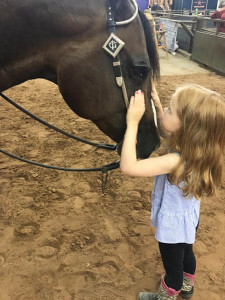 Mimi, the mini horse whisperer.