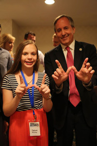 Ken Paxton giving the "W" sign of support for the AQHA Youth World Show. Photo courtesy of Tatum Richey.