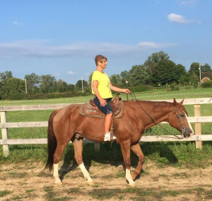 Nancy taking a ride on 27-year-old Travis in August of 2015.