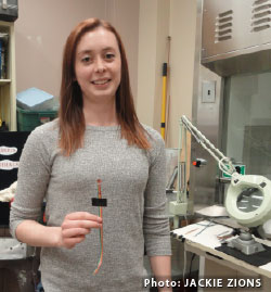 Danielle Thomason holding a sensor. Photo Credit: Jackie Zions