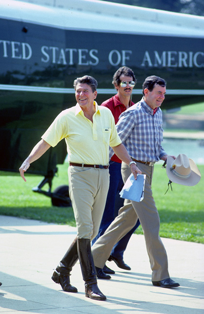 Mark Reinstein Shutterstock.com President Ronald Reagan walks from Marine One towards a limo after he'd been out riding horses at Camp David.