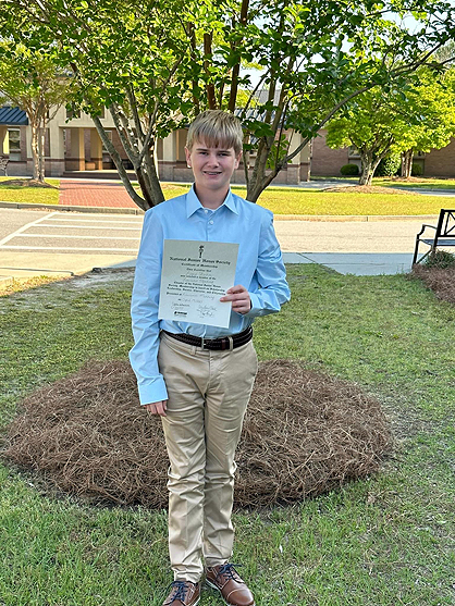 An Early Mother’s Day Present – Logan Starnes Inducted into NJHS!