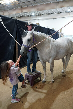 EC Photo of the Day: Little Hands, Big Love for Horses